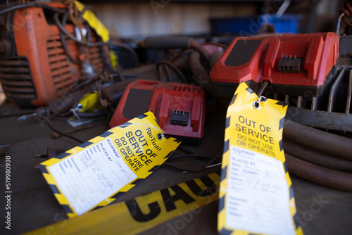 Wall Mural Safety workplaces yellow out of service tag attached on faulty damage defect uns