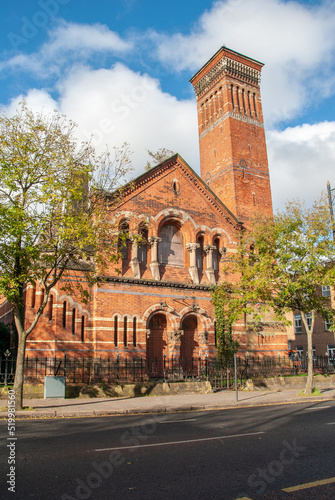Abandoned and shut down historic red brick Belfast Methodist church building on University road, Belfast, Northern Ireland, UK photo