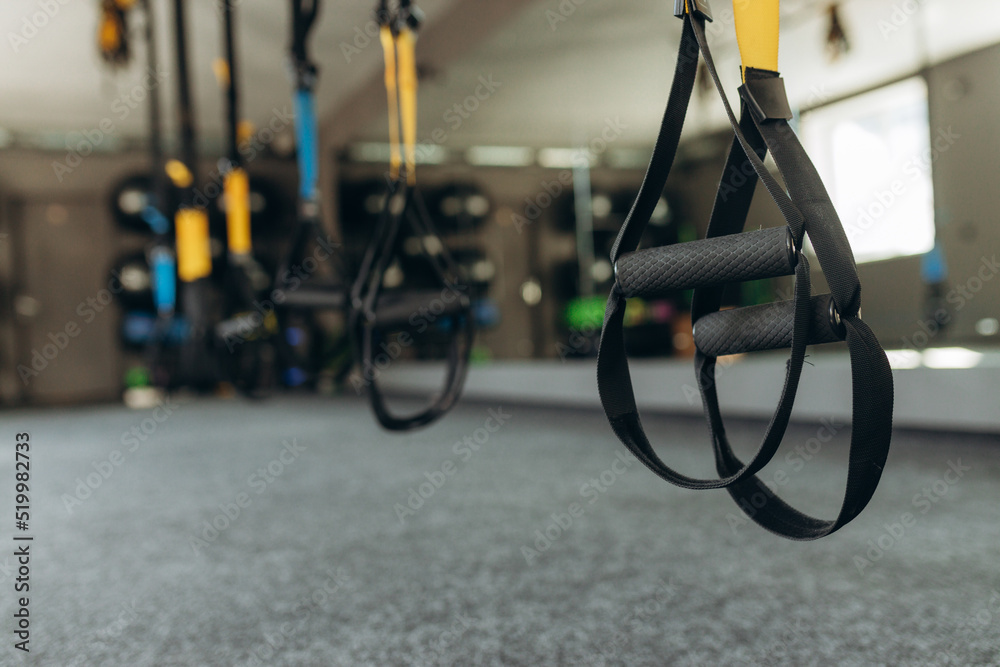 Sport accessories fitness and gym workout items for Healthy: training straps loop equipment. Close up loop functional training equipment Sport accessories fitness and gym workout items for Healthy: training straps loop equipment. Close up loop functional training equipment