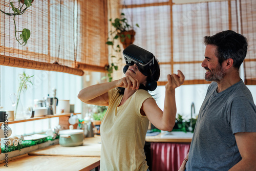 Lovely couple having fun with virtual reality headset
