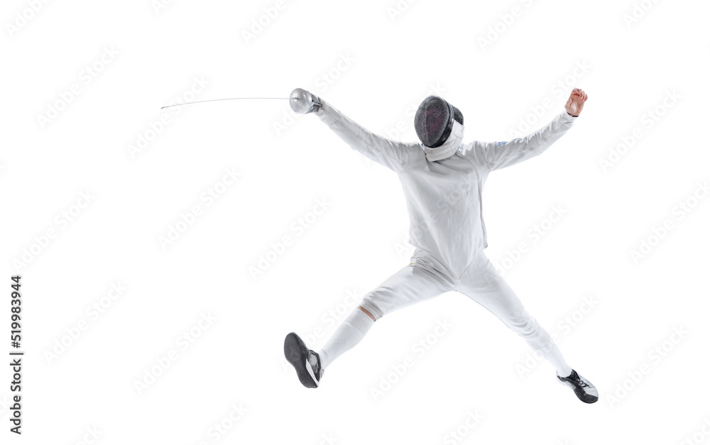 Dynamic portrait of young man, fencer in in fencing costume with sword in hand training isolated on white studio background. Sport, energy, skills