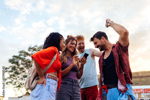 Four festival people using phone