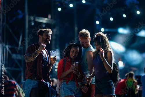 Young friends enjoying a music festival