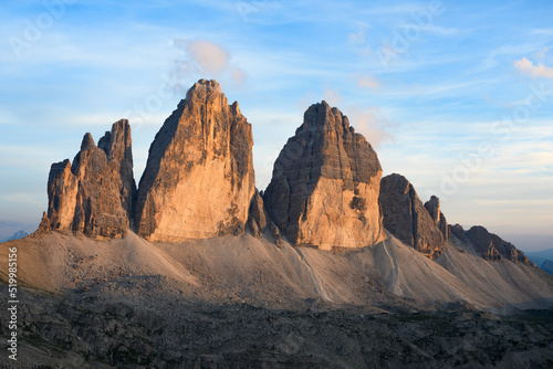 Stunning view of the Three Peaks of Lavaredo, (Tre cime di Lavaredo) during a beautiful sunset. The Three Peaks of Lavaredo are the undisputed symbol of the Dolomites, Italy. © Travel Wild