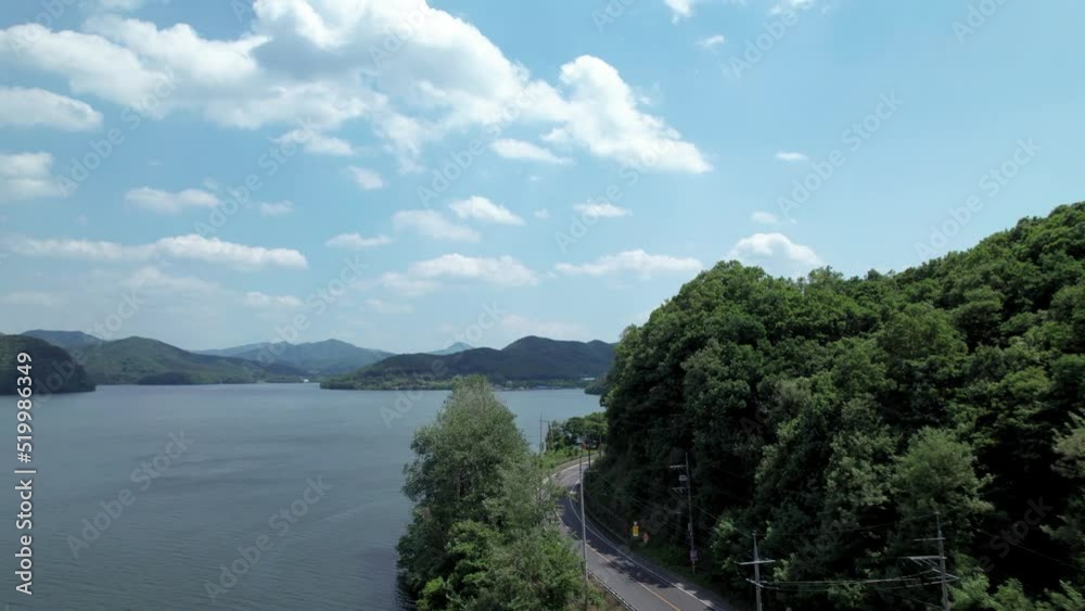 Aerial Drone Shot Road and Trees Next to River and Mountain in Korea Han River Aerial Drone Shot Road and Trees Next to River and Mountain in Korea Han River