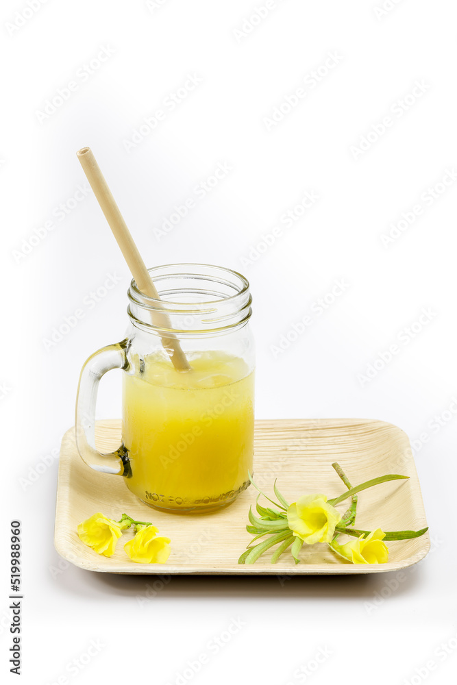 Fototapeta premium Bamboo straw in an orange juice glass