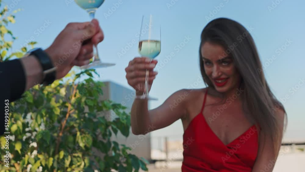 Romantic dinner two open-air terrace roof hotel, restaurant. Man jacket pours champagne into glass woman red evening dress. Marriage proposal Fruits table plate. Bright sunny weather, light breeze Romantic dinner two open-air terrace roof hotel, restaurant. Man jacket pours champagne into glass woman red evening dress. Marriage proposal Fruits table plate. Bright sunny weather, light breeze