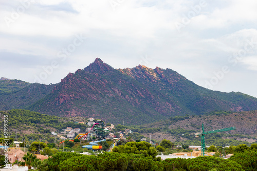 Mountains. Desert of Las Palmas seen from the town of Benicasim, in Castellón. Mountainous and rocky system with green trees throughout the rocky extension, in Spain. Europe. Horizontal photography.