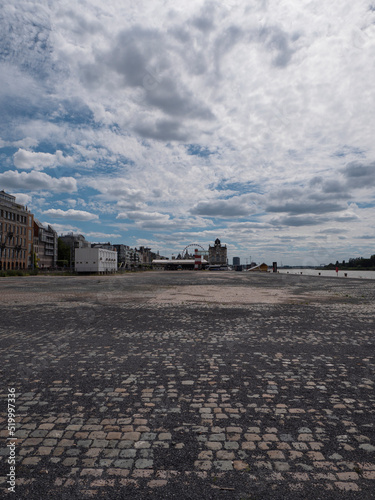 Dramatic cityscape of the Scheldt quays in the city of Antwerp, Belgium with a dramatic cloud field