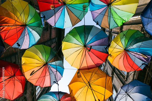 Colorful umbrellas hanging on the street in the karakoy district of Istanbul photo