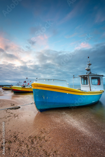 Beautiful sunset with fishing boats at the beach of Baltic Sea in Sopot  Poland