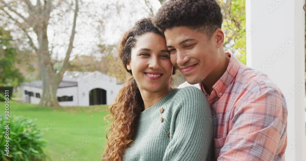Video of smiling biracial couple spending time in the garden Video of smiling biracial couple spending time in the garden