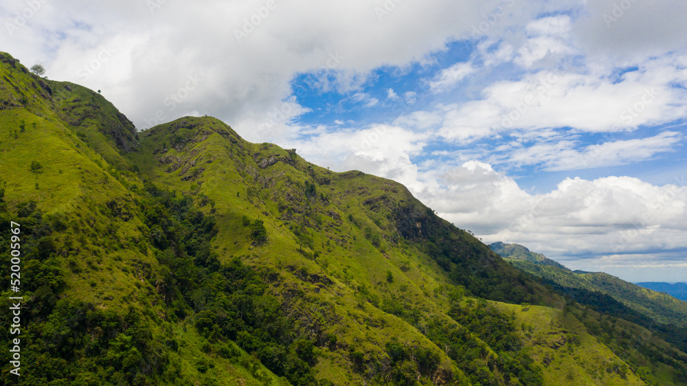 Aerial view of Tropical mountain range and mountain slopes with rainforest. Ella Rock, Sri Lanka.