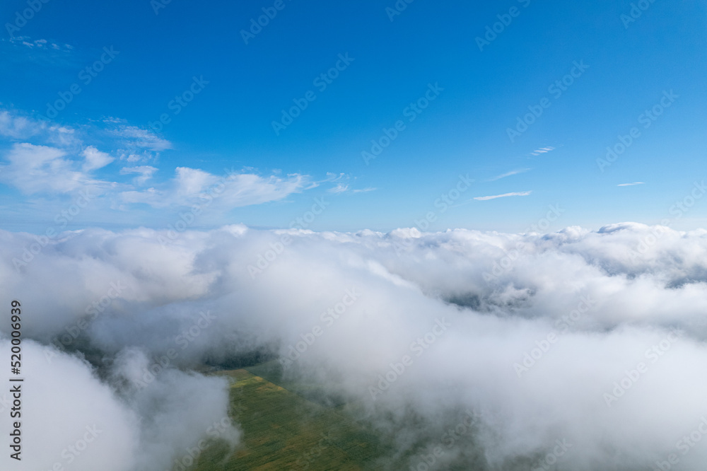 Flying over beautiful fluffy clouds