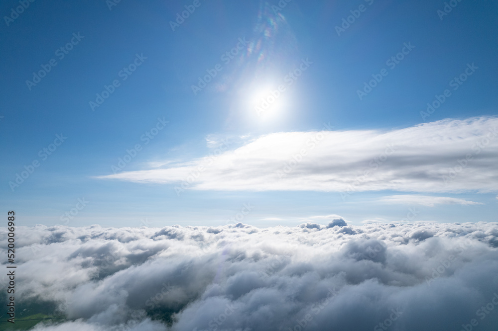 Flying over beautiful fluffy clouds
