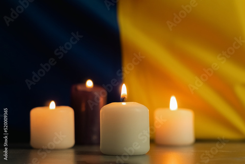 A group of burning candles against the background