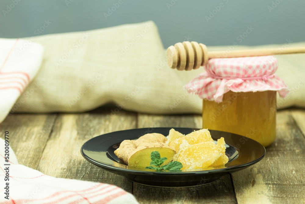 Fresh ginger root and candied ginger in sugar Fresh ginger root and candied ginger in sugar
