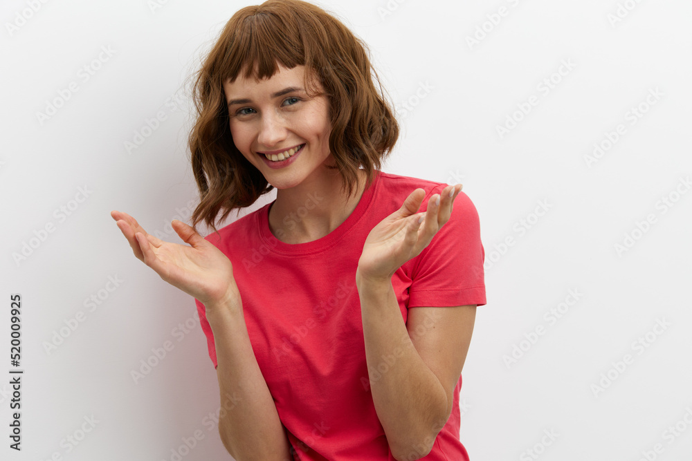 horizontal photo of a joyful, happy, laughing woman spreading her arms to the sides, standing on a white background with an empty space for inserting an advertising layout horizontal photo of a joyful, happy, laughing woman spreading her arms to the sides, standing on a white background with an empty space for inserting an advertising layout