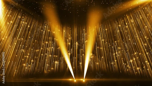 Golden particle light and light illuminate the background of the award stage.