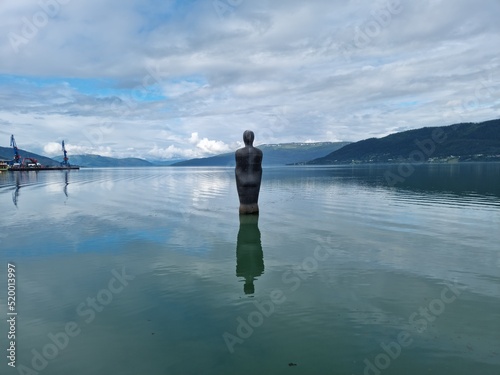 Havmannen, or Havmann is a granite stone sculpture located in the city of Mo i Rana in northern Norway and is keeping watch over the harbor photo