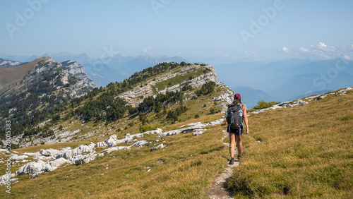Woman hiking the Chartreuse moutains, in the French Alps, near the Dent de Crolles, Grenoble  © Yves