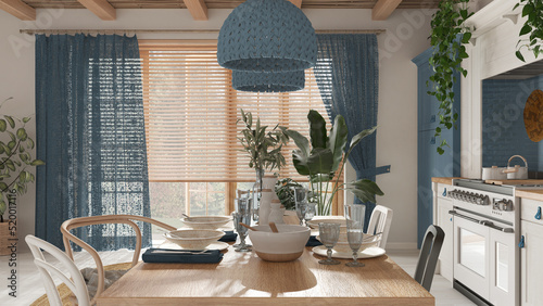 Wooden country dining table setting in white and blue tones. Kitchen, pendant lamps and window. Scandinavian boho interior design