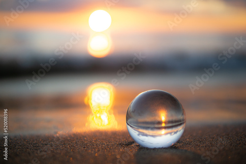 夕暮れの砂浜と水晶玉 photo
