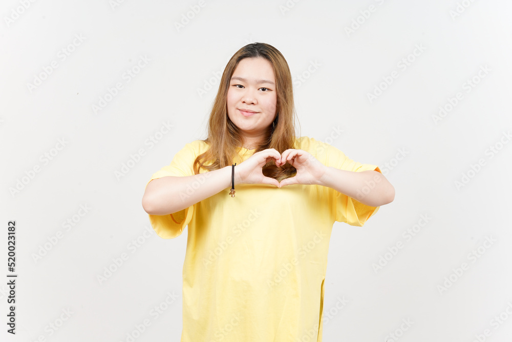 Showing Love Sign of Beautiful Asian Woman wearing yellow T-Shirt Isolated On White Background Showing Love Sign of Beautiful Asian Woman wearing yellow T-Shirt Isolated On White Background