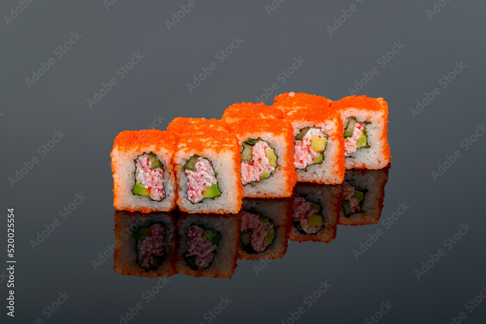 California roll with crab on black with reflection
