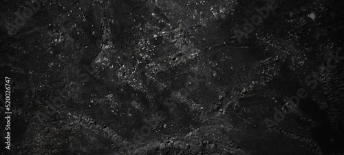 Dark black stone background. scary black concrete texture. Stone wall background. © Adam