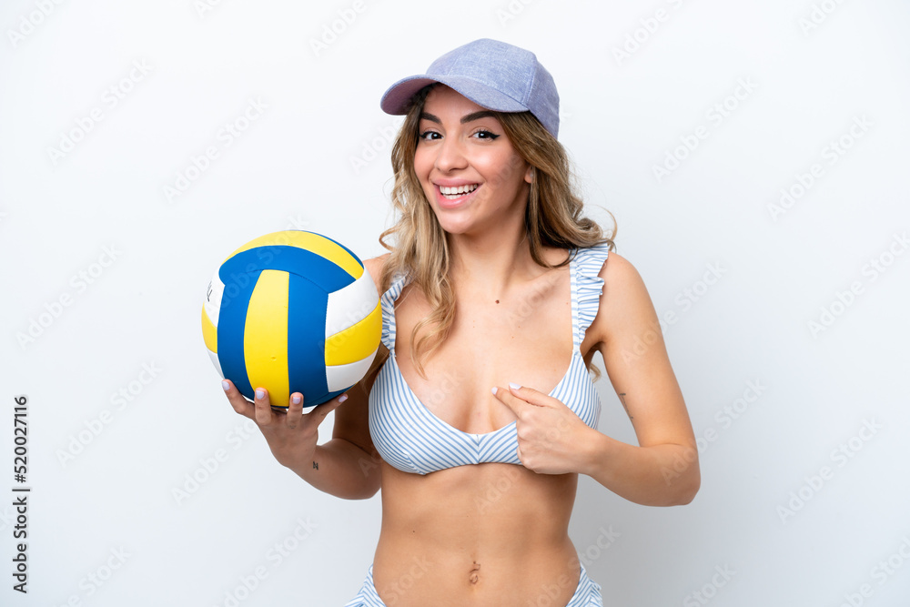 Young woman playing volleyball wearing a swimsuit isolated on white background with surprise facial expression Young woman playing volleyball wearing a swimsuit isolated on white background with surprise facial expression