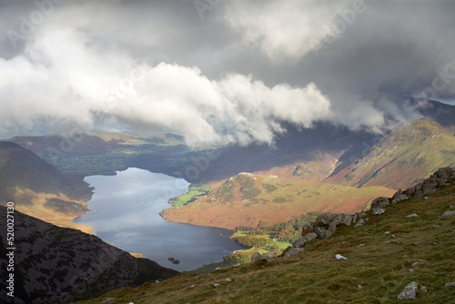 Looking down onto Crummock Water with Grasmoor covered in cloud from High Stile in the Autumn in the Lake District, UK. photo