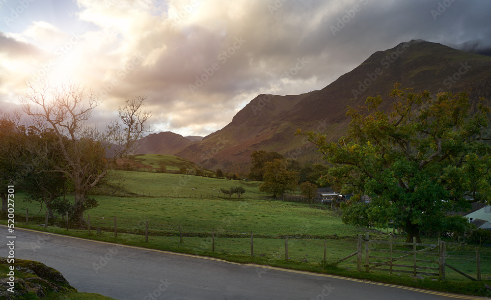 Fototapeta premium Dawn views of High Crag and High Stile with Haystacks off in the distance near Buttermere in the English Lake District, UK.