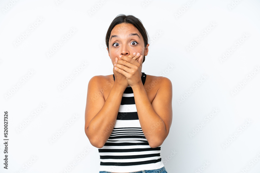 Young hispanic woman isolated on white background covering mouth with hands Young hispanic woman isolated on white background covering mouth with hands