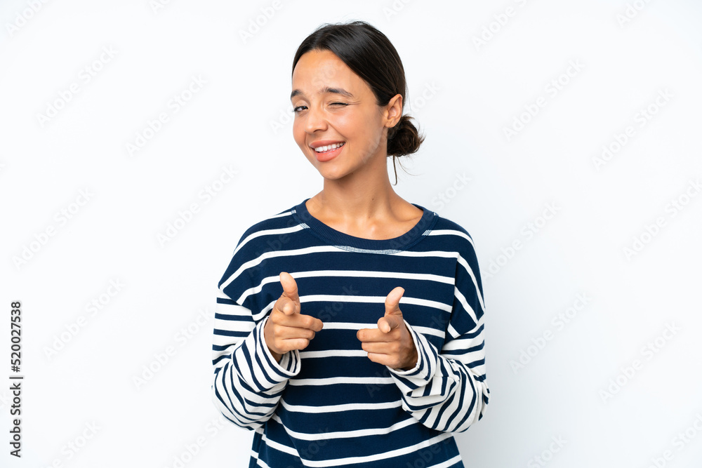 Young hispanic woman isolated on white background pointing to the front and smiling Young hispanic woman isolated on white background pointing to the front and smiling