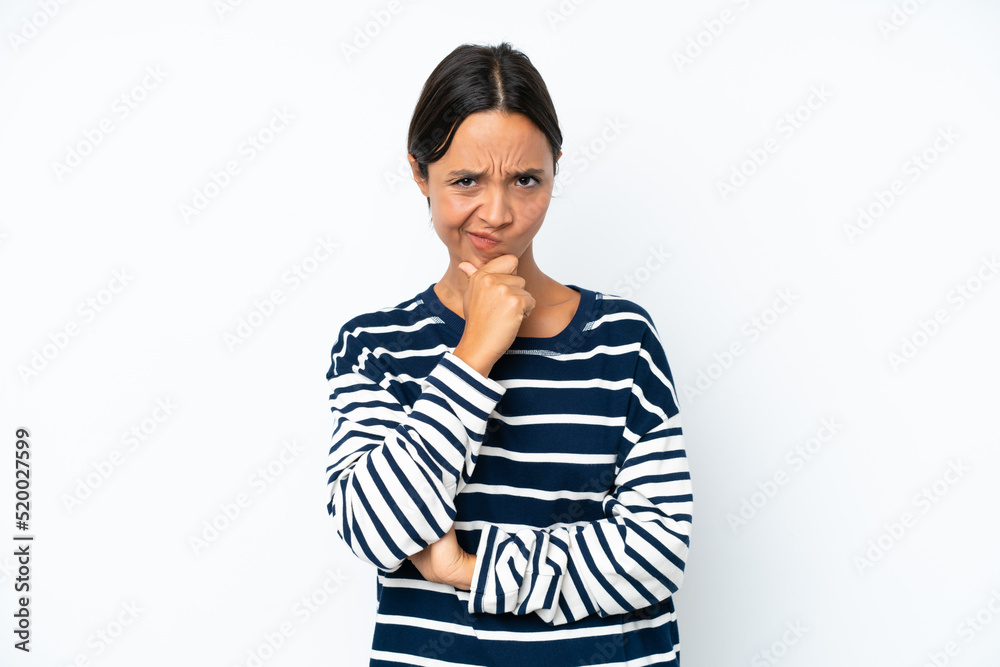 Young hispanic woman isolated on white background having doubts Young hispanic woman isolated on white background having doubts