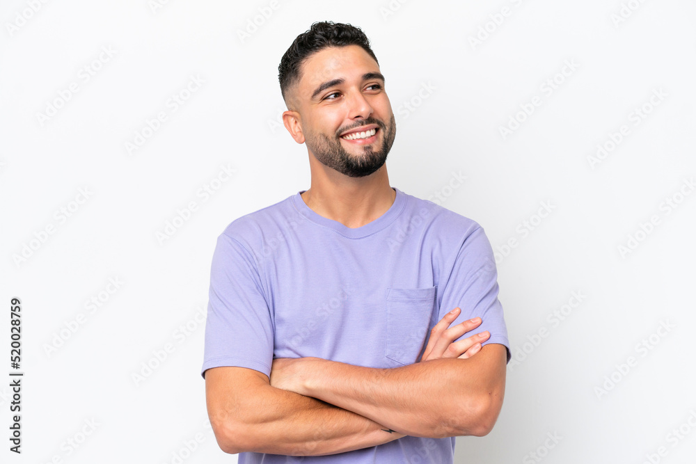Fototapeta premium Young Arab handsome man isolated on white background looking up while smiling