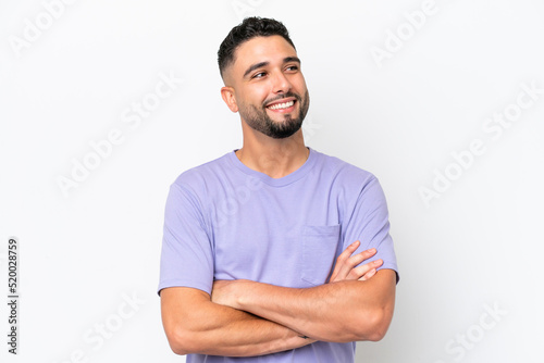 Young Arab handsome man isolated on white background looking up while smiling