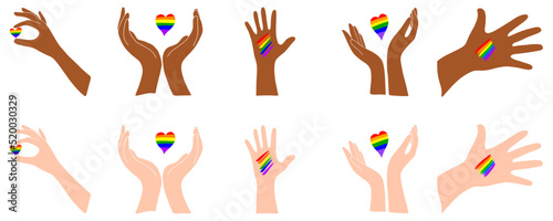 A set of hands with a heart. Rainbow heart. Light and dark skin. LGBT.