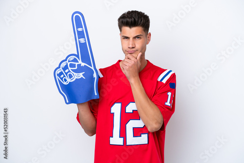 Young caucasian sports fan man isolated on white background thinking