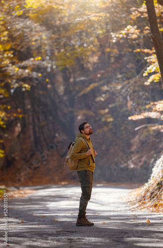 Young handsome man posing in autumn forest. © YURII Seleznov