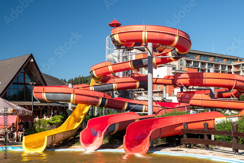 Red and yellow water slide in waterpark