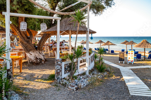 Fototapeta Naklejka Na Ścianę i Meble -  Taverna and sandy beach on west coast of Rhodes island in Greece
