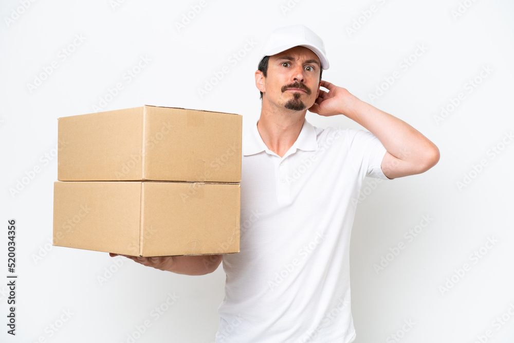 Delivery caucasian man isolated on white background having doubts Delivery caucasian man isolated on white background having doubts