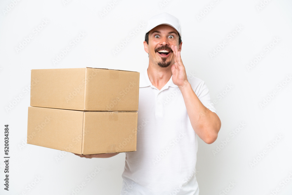 Delivery caucasian man isolated on white background with surprise and shocked facial expression Delivery caucasian man isolated on white background with surprise and shocked facial expression