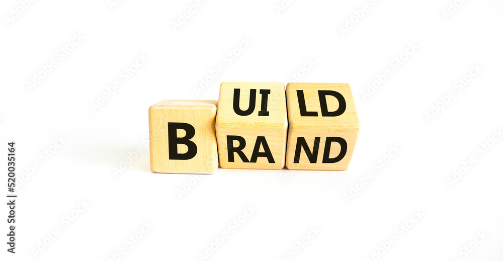 Build your brand symbol. Concept words Build brand on wooden cubes. Beautiful white table white background. Build your brand and business concept. Copy space. Build your brand symbol. Concept words Build brand on wooden cubes. Beautiful white table white background. Build your brand and business concept. Copy space.