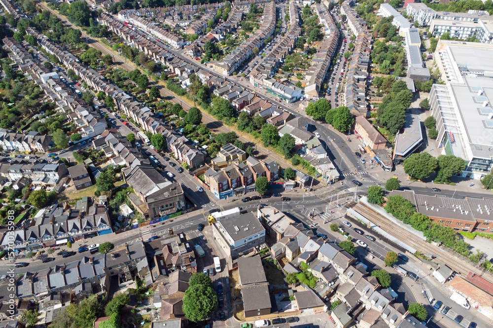 Aerial view of the area of Highams Park including the railway line and level crossing Aerial view of the area of Highams Park including the railway line and level crossing