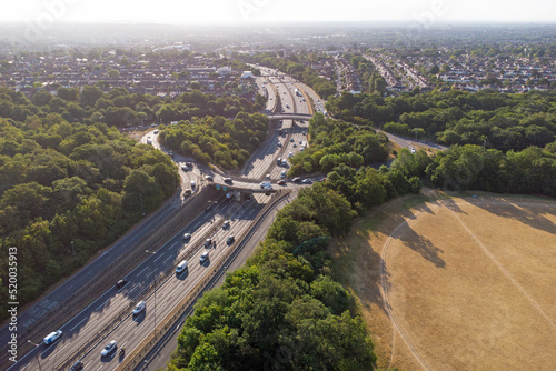 Waterworks roundabout in Walthamstow. A large roundabout with the A406 dual carriageway passing underneath in the morning sun surrounded by the forest photo