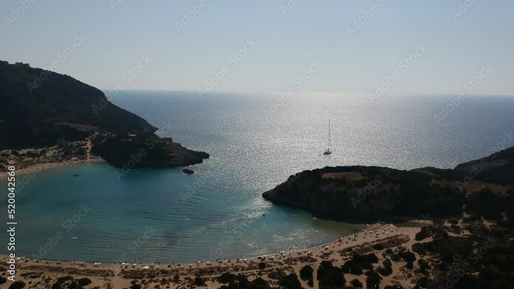 Aerial view of the famous semicircular sandy beach and lagoon of Voidokilia, Greece overcrowded during high tourist season Aerial view of the famous semicircular sandy beach and lagoon of Voidokilia, Greece overcrowded during high tourist season