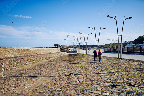 Stone beach promenade and pier.